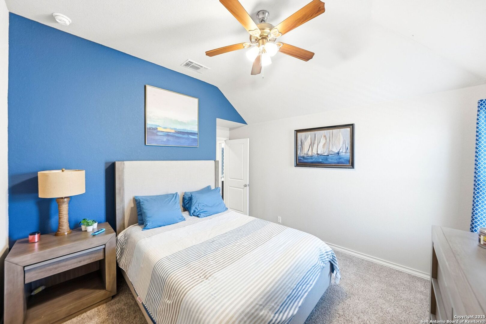 30622 Horseshoe Path Bulverde, TX 78163 - Photo 27 of 44 a bedroom with a bed and a lamp