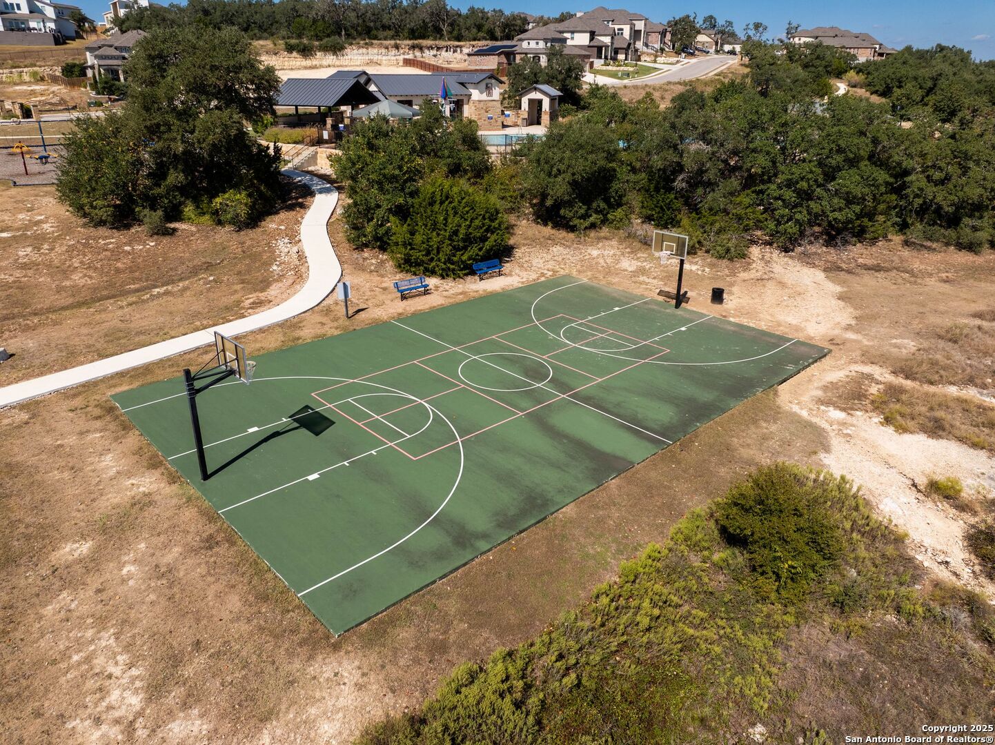 30622 Horseshoe Path Bulverde, TX 78163 - Photo 39 of 44 a view of a tennis ground with large trees