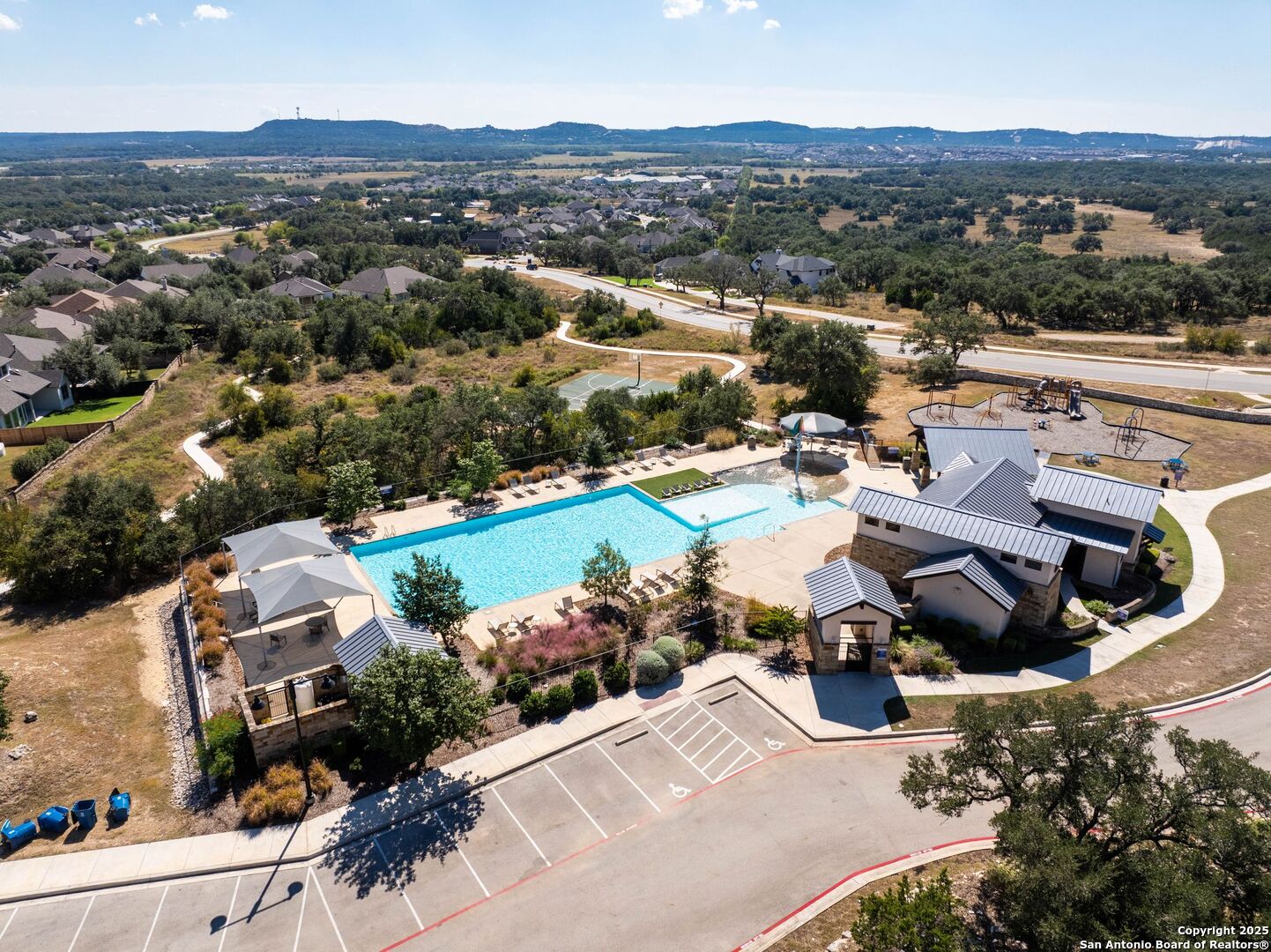30622 Horseshoe Path Bulverde, TX 78163 - Photo 42 of 44 an aerial view of a town with swimming pool and mountains