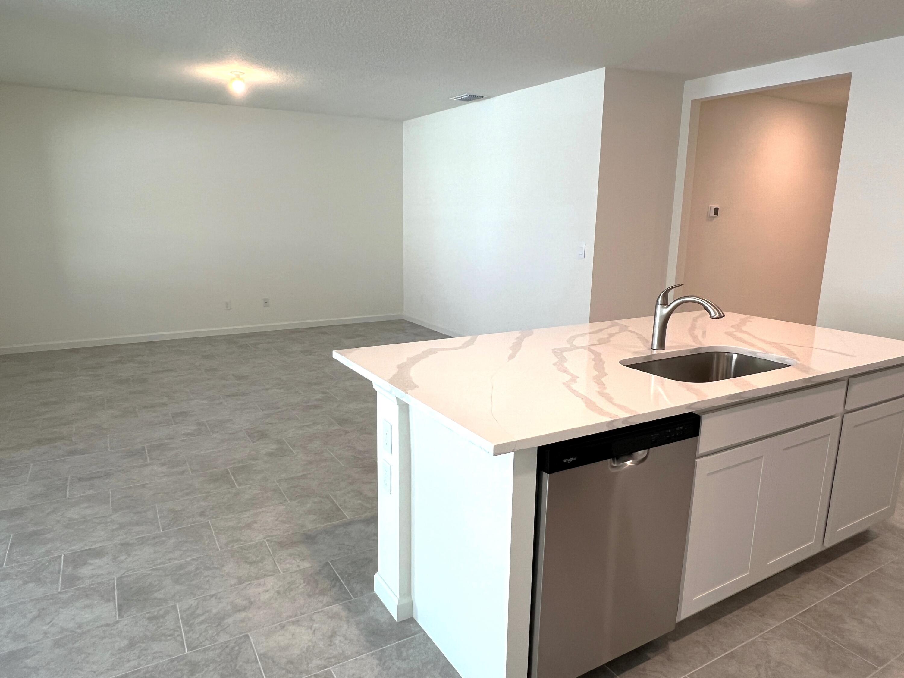 498 Seaspray Drive Fort Pierce, FL 34945 - Photo 7 of 38 Kitchen Island.Family Room