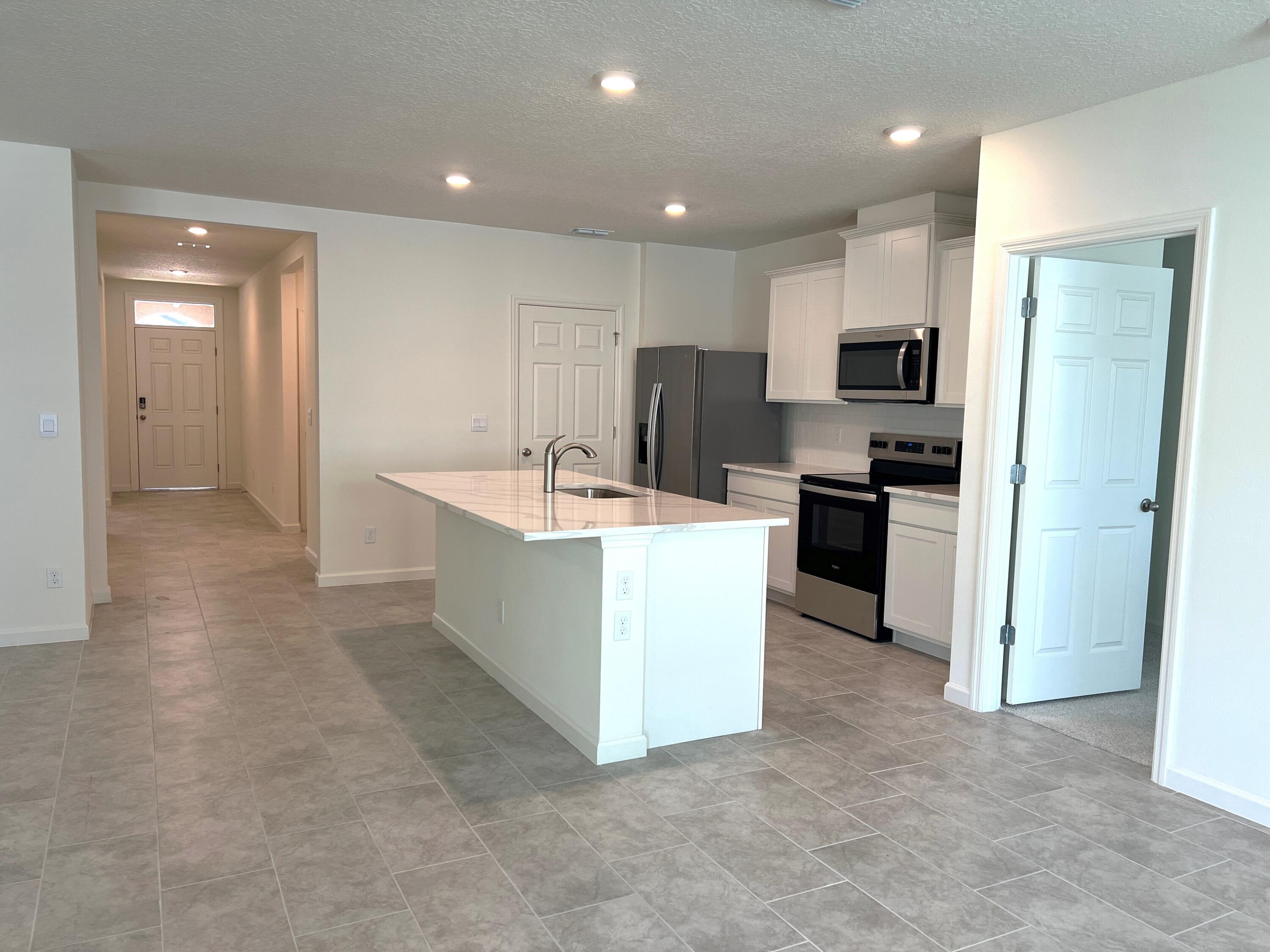 498 Seaspray Drive Fort Pierce, FL 34945 - Photo 9 of 38 Kitchen.Hall