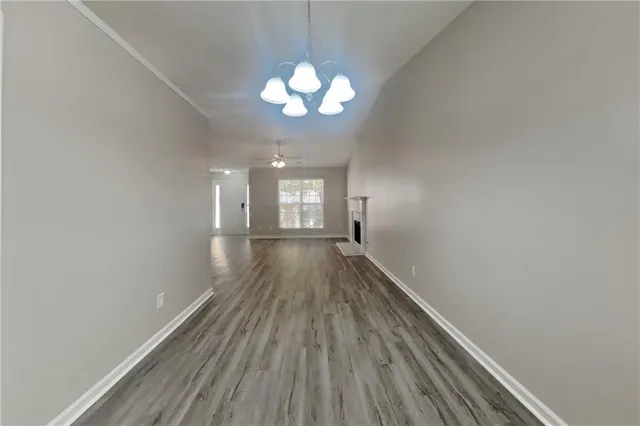 a view of gallery with wooden floor