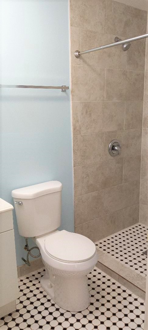 2762 Circle Drive Markham, IL 60428 - Photo 12 of 18 a white toilet sitting next to a bathroom sink