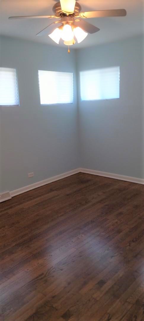 2762 Circle Drive Markham, IL 60428 - Photo 14 of 18 a view of wooden floor and windows in a room