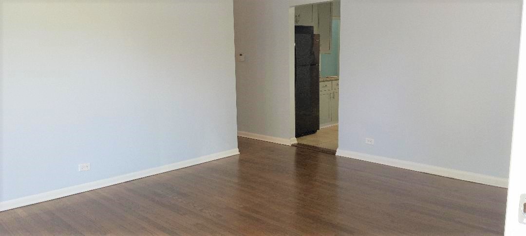 2762 Circle Drive Markham, IL 60428 - Photo 8 of 18 a view of an empty room with wooden floor