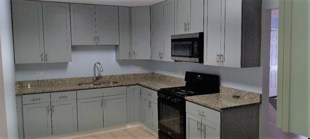 2762 Circle Drive Markham, IL 60428 - Photo 9 of 18 a kitchen with granite countertop white cabinets and black appliances