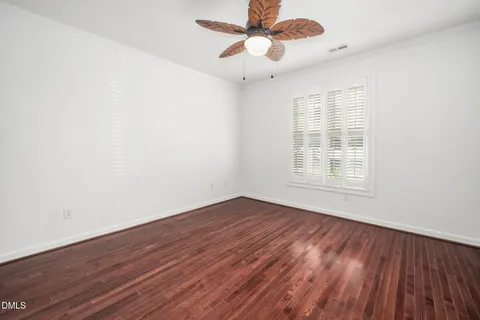 a view of a balcony with wooden floor