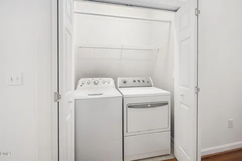 a white toilet sitting next to a bath tub