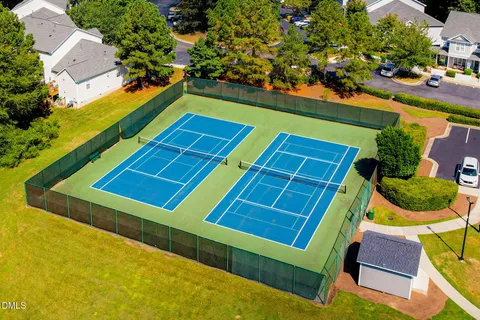 swimming pool view with a seating space