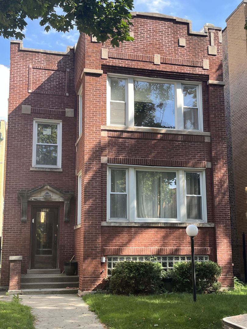 8019 South Vernon Avenue, Unit 2 Chicago, IL 60619 - Photo 1 of 13 a front view of a house