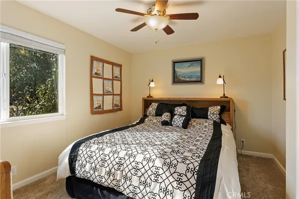 a bedroom with a bed and window