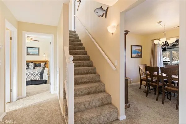 a view of a livingroom with furniture and entryway