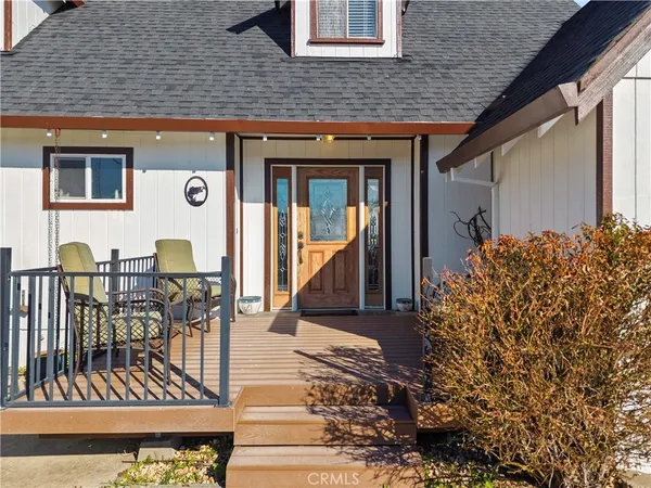 an aerial view of a house with a lake view