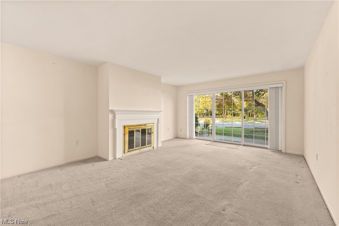 22701 Center Ridge Road, Unit 113 Rocky River, OH 44116 - Photo 8 of 29 View of fireplace & patio