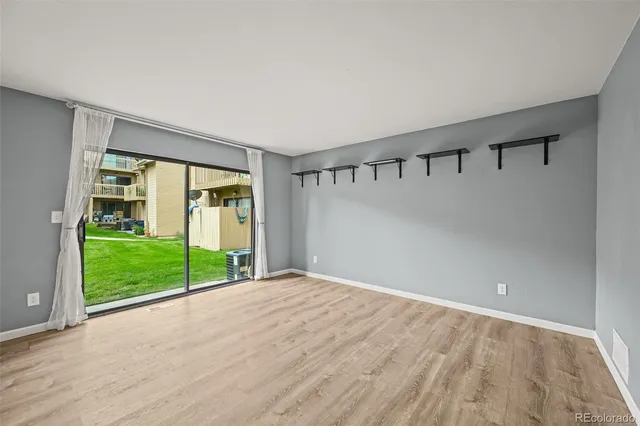 a view of an empty room with a window