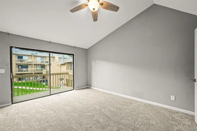 a view of a room with wooden floor and windows