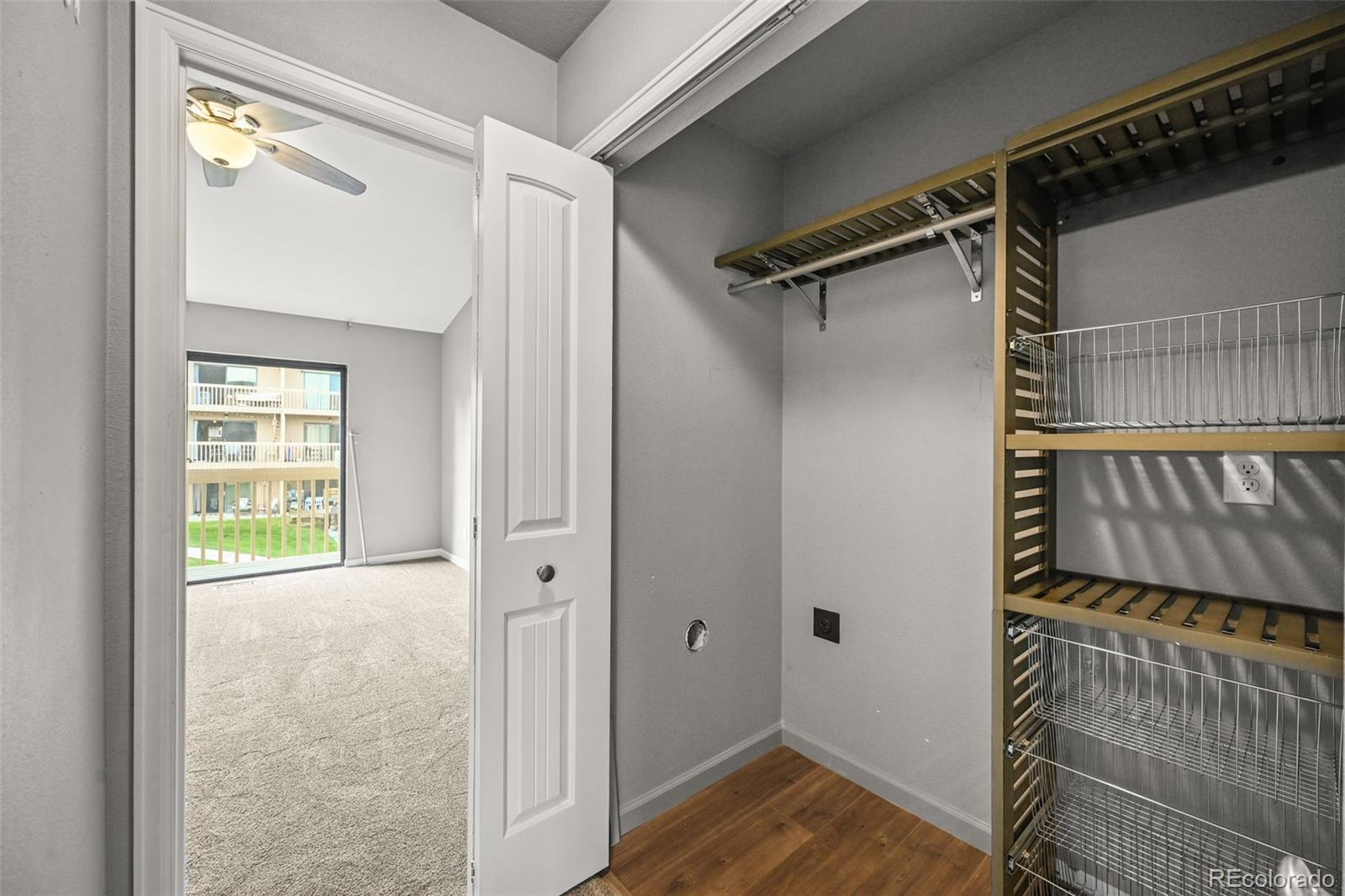 232 South Oman Road Castle Rock, CO 80104 - Photo 6 of 50 a view of a room with wooden floor and windows