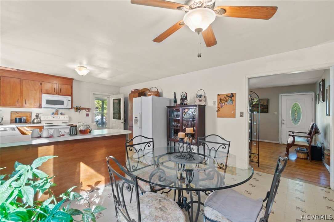 268 Old Sheppards Road Farmville, VA 23901 - Photo 18 of 37 a dining room with furniture a kitchen view and a chandelier