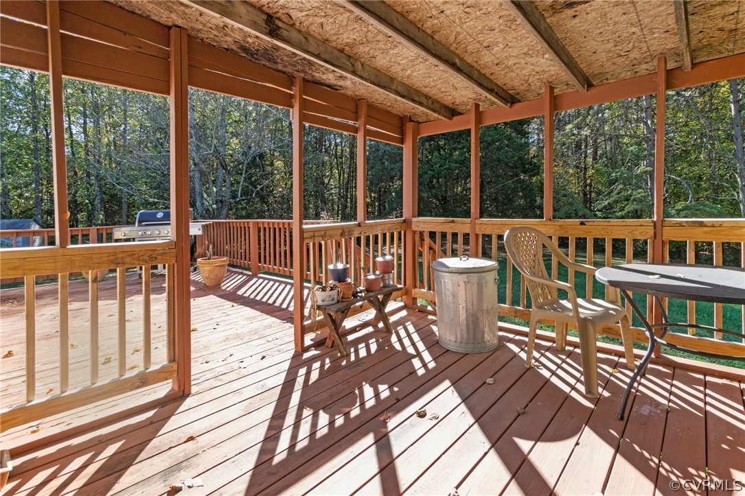 268 Old Sheppards Road Farmville, VA 23901 - Photo 25 of 37 a view of a patio with a table chairs and wooden floor