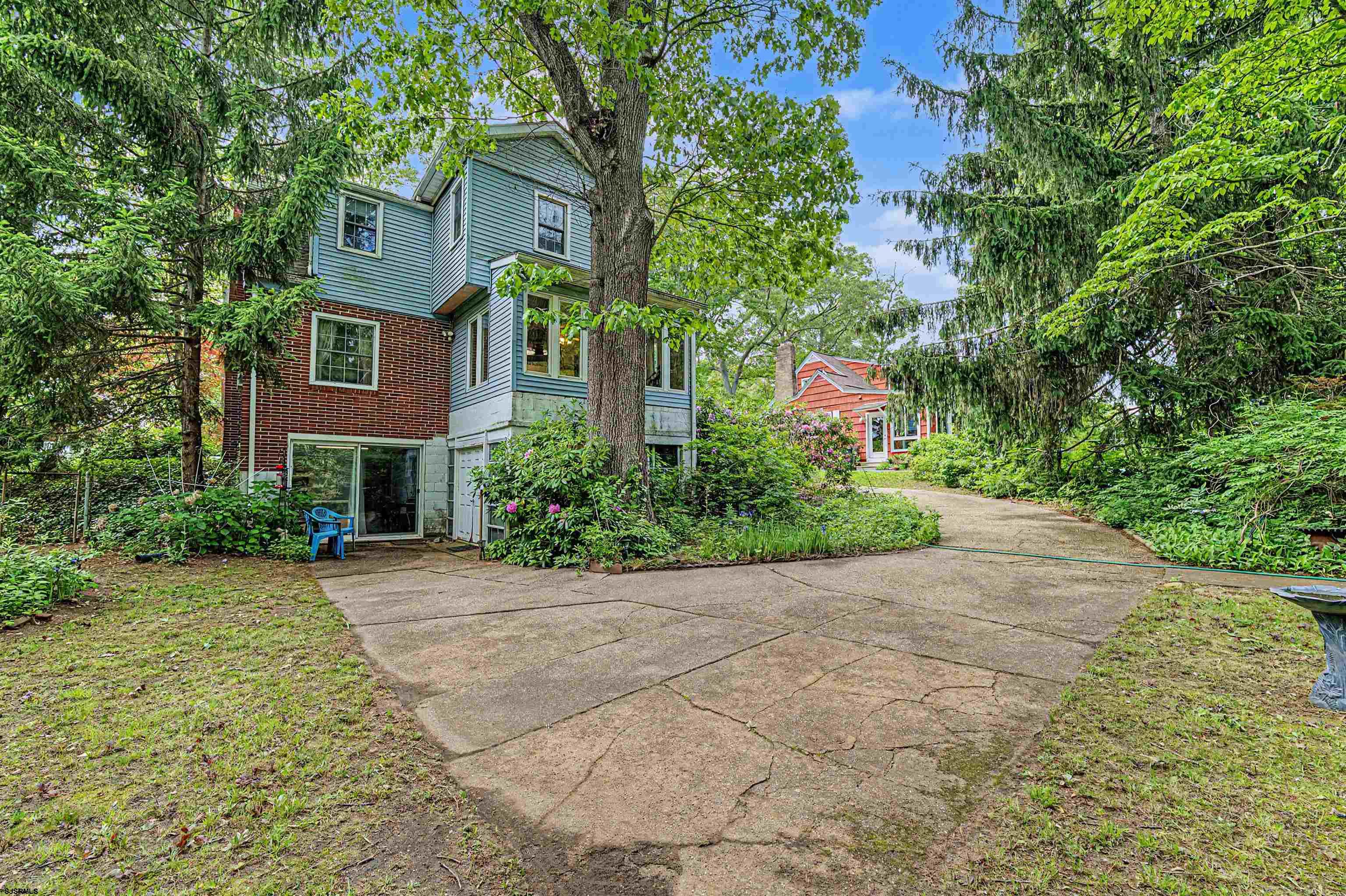 144 Pitney Road Absecon, NJ 08201 - Photo 36 of 47 a front view of a house with a yard and a tree