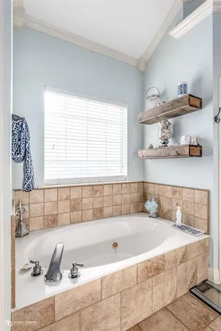 a bath tub sitting next to a window