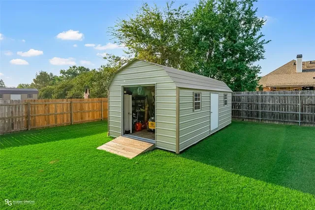 a view of a backyard with a garden