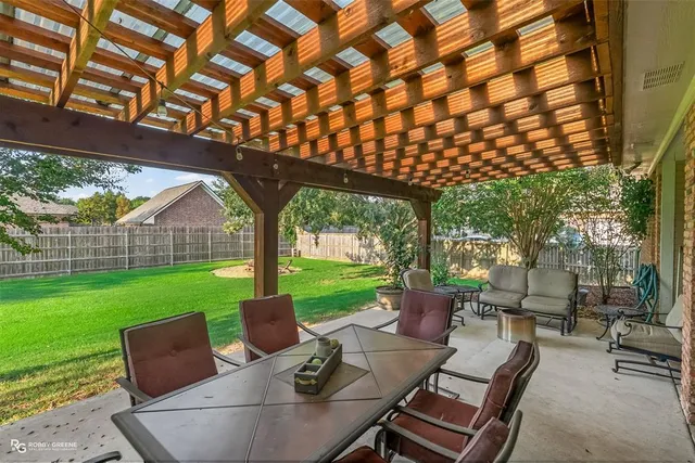 a patio view with a garden view