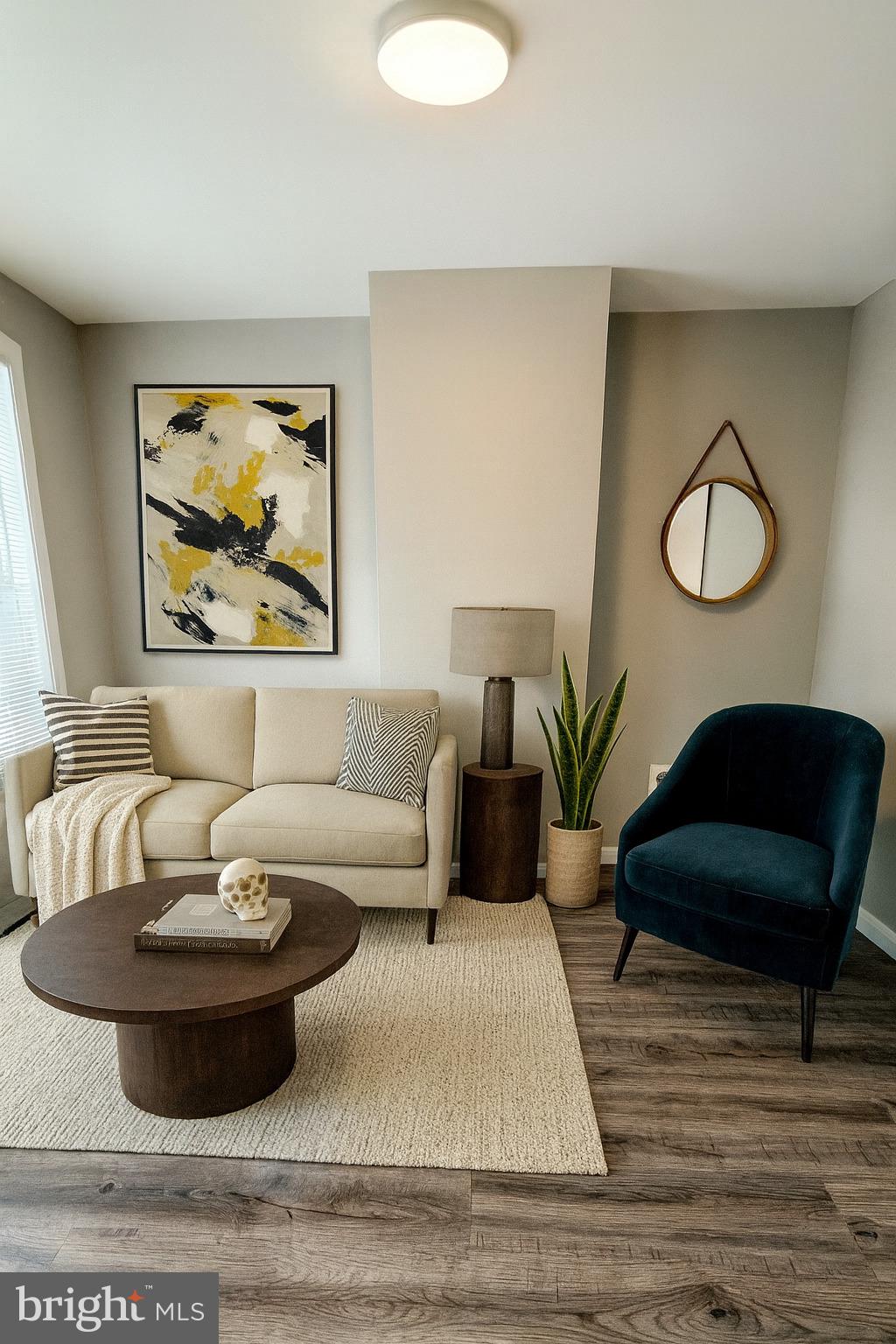 a living room with furniture and a lamp