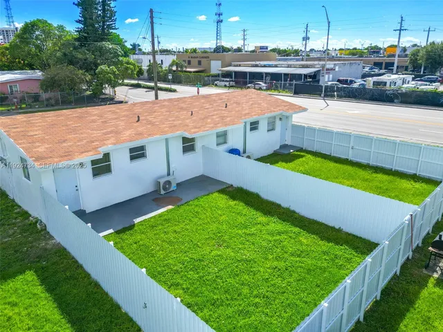 a view of a swimming pool with a yard
