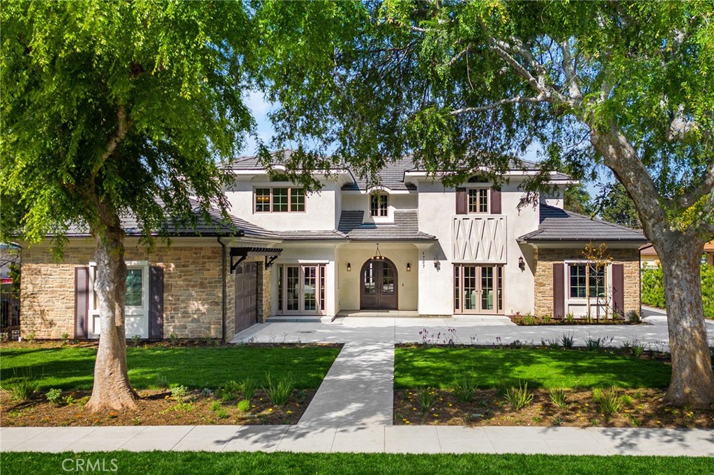 front view of a house with a garden