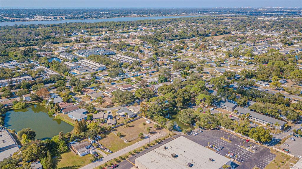 7550 90th Street Seminole, FL 33777 - Photo 16 of 18 an aerial view of a house with a lake view