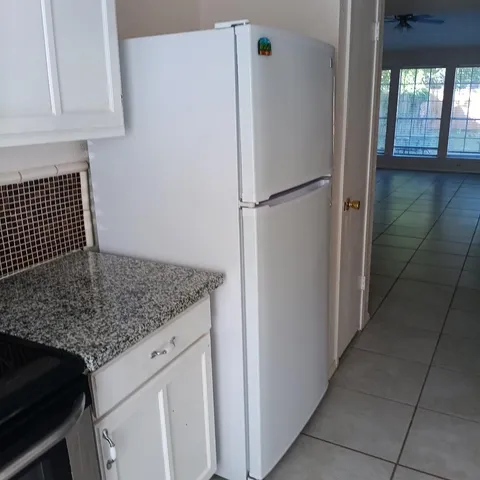 a view of a kitchen counter space and stove