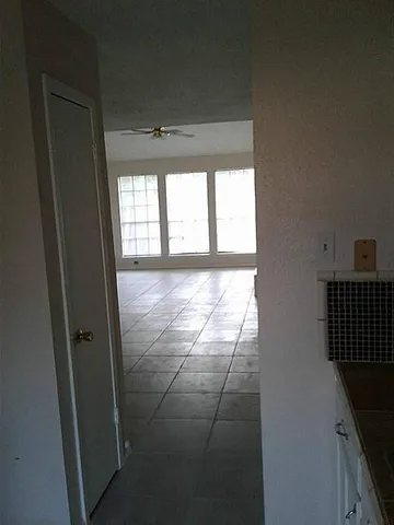 a bathroom with a granite countertop sink and vanity