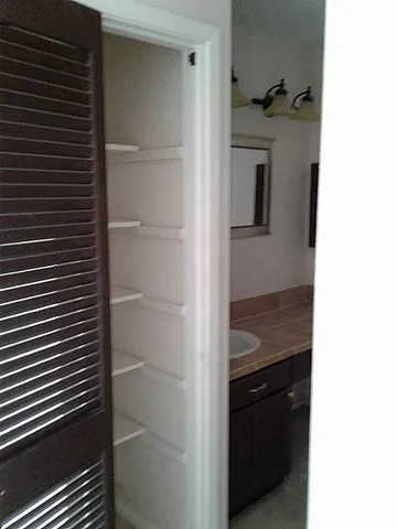 a view of an empty room and a window