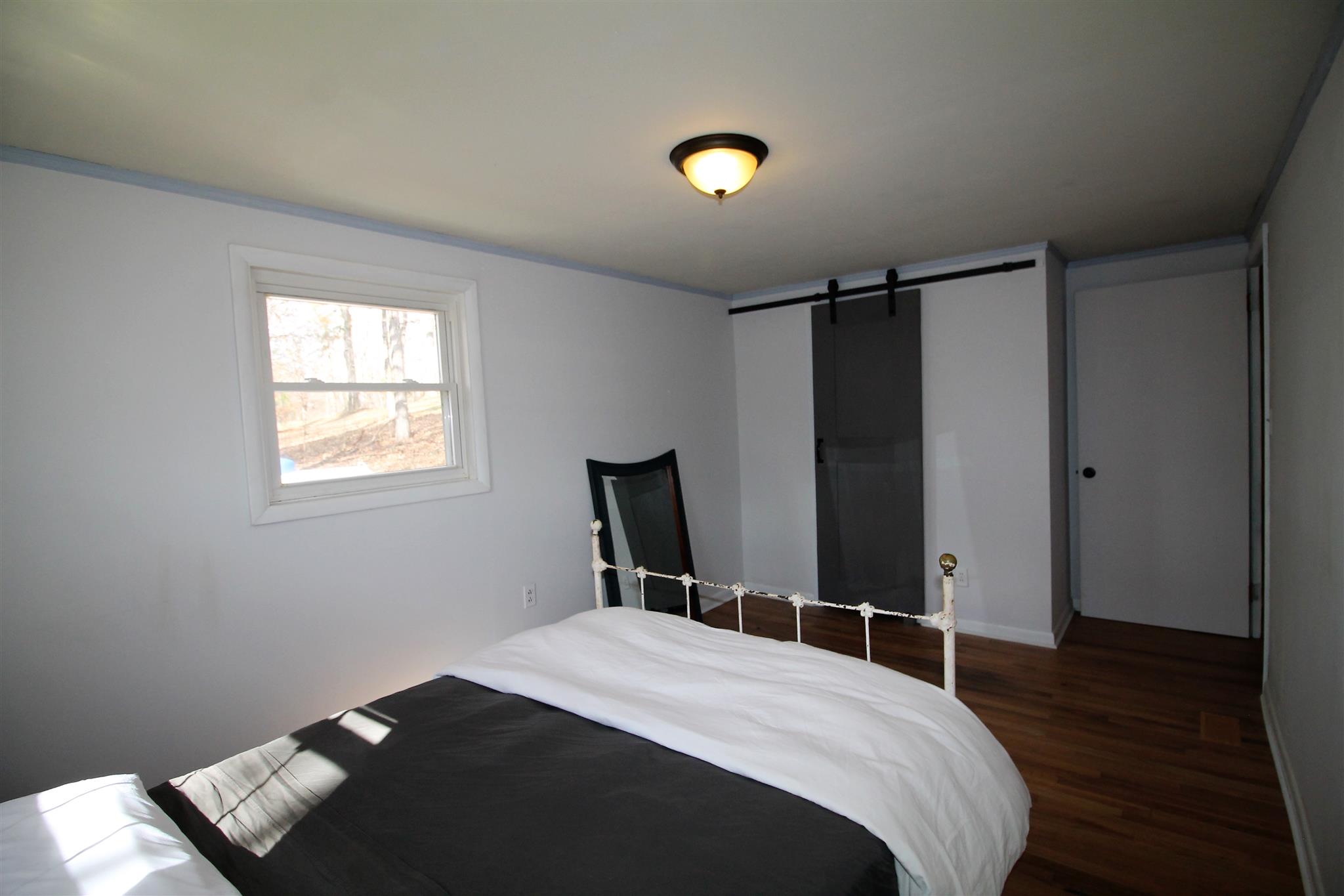 7205 Sleepy Hollow Road Fairview, TN 37062 - Photo 13 of 26 a bedroom with a bed and a window