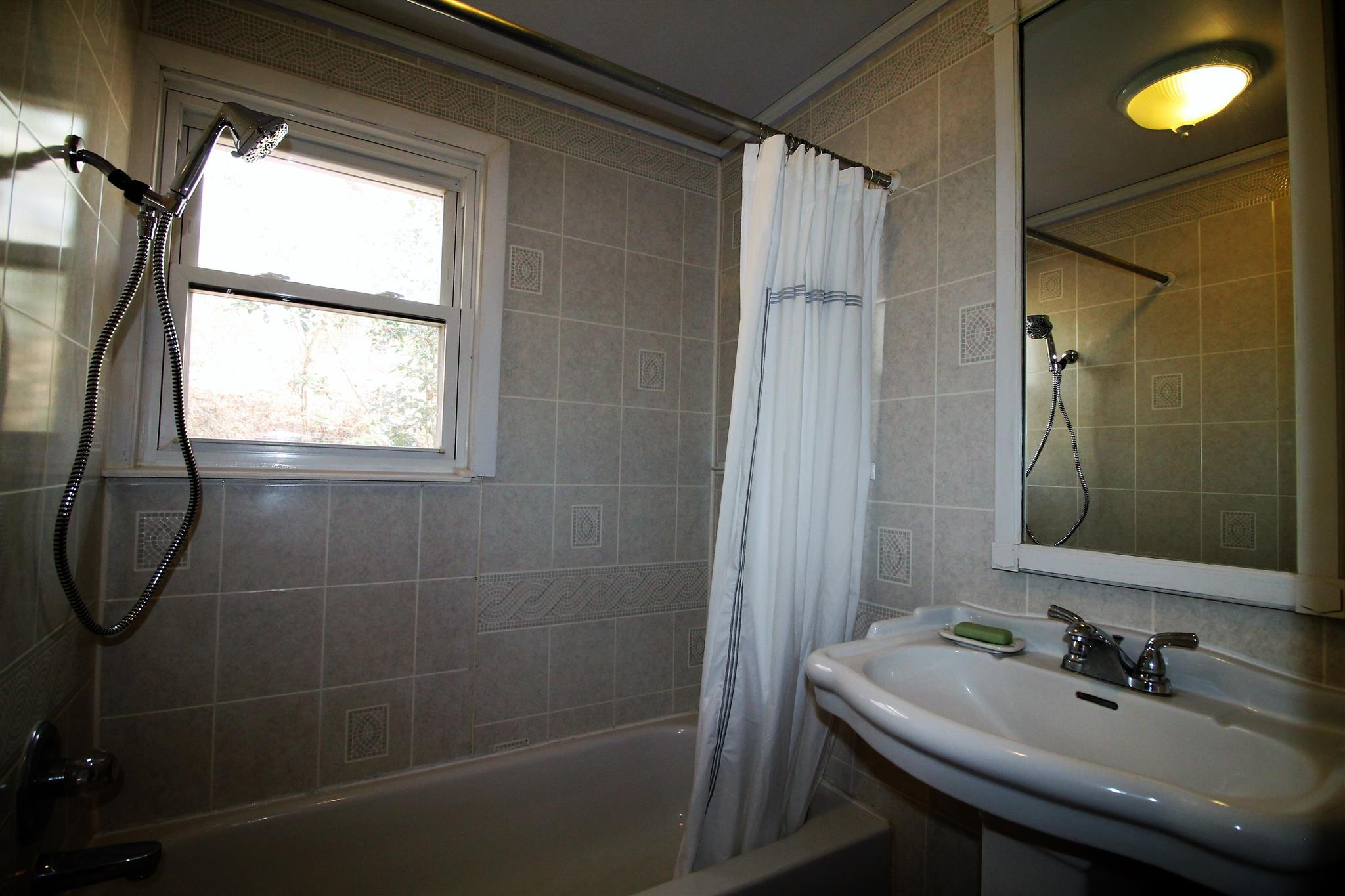 7205 Sleepy Hollow Road Fairview, TN 37062 - Photo 16 of 26 a bathroom with a sink a toilet and shower