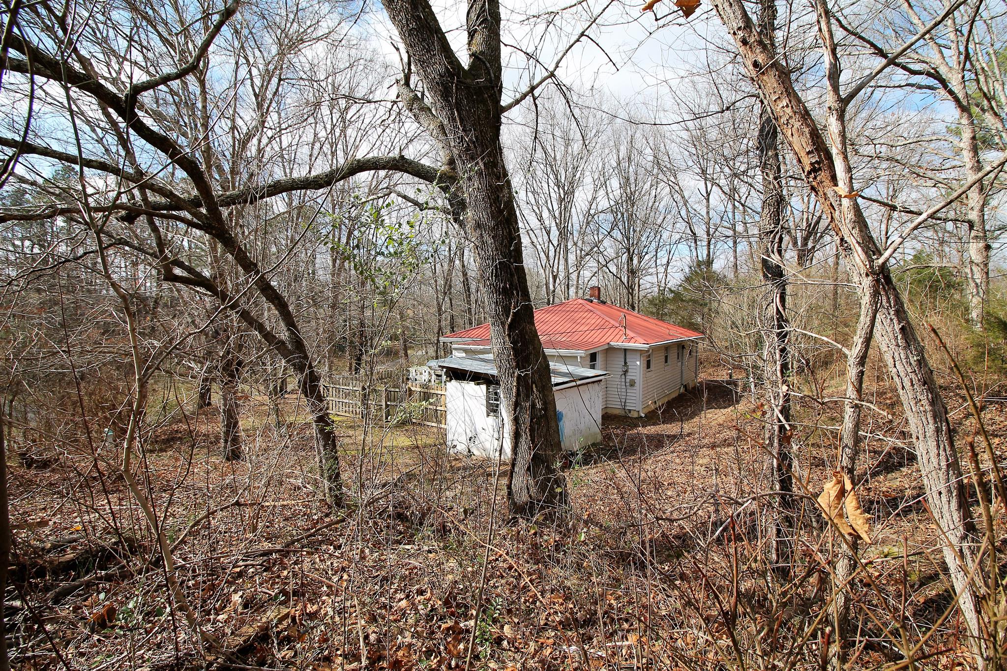 7205 Sleepy Hollow Road Fairview, TN 37062 - Photo 23 of 26 a view of a backyard with large trees