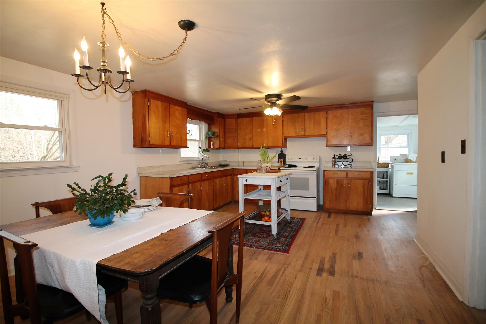 7205 Sleepy Hollow Road Fairview, TN 37062 - Photo 6 of 26 a kitchen with cabinets a counter space dining table and stainless steel appliances