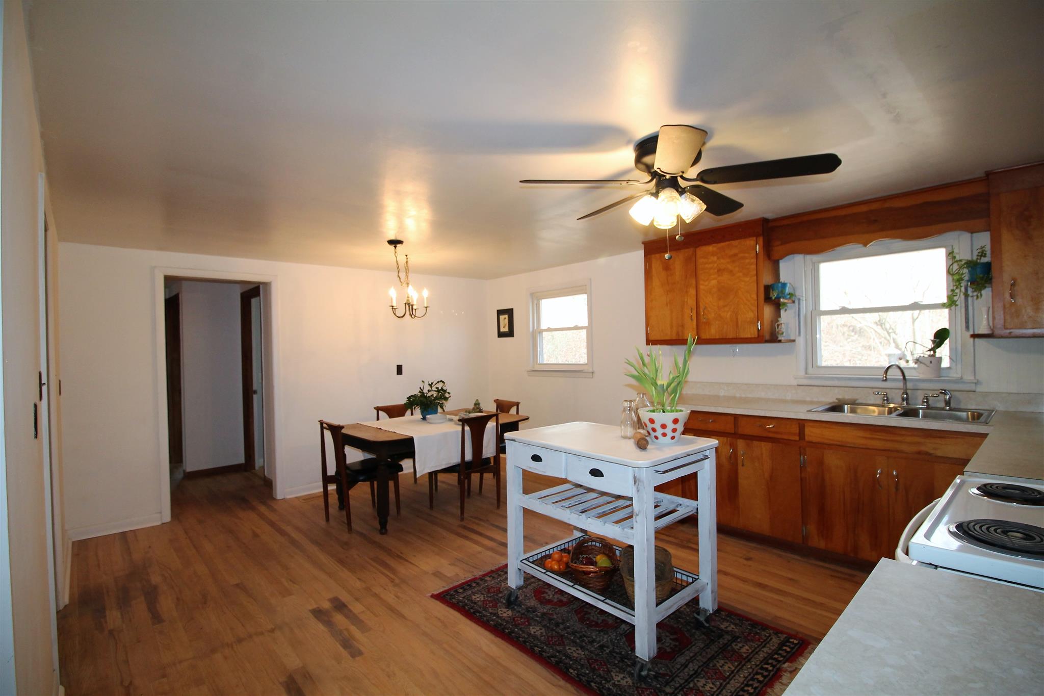 7205 Sleepy Hollow Road Fairview, TN 37062 - Photo 8 of 26 a dining room with wooden floor and a chandelier