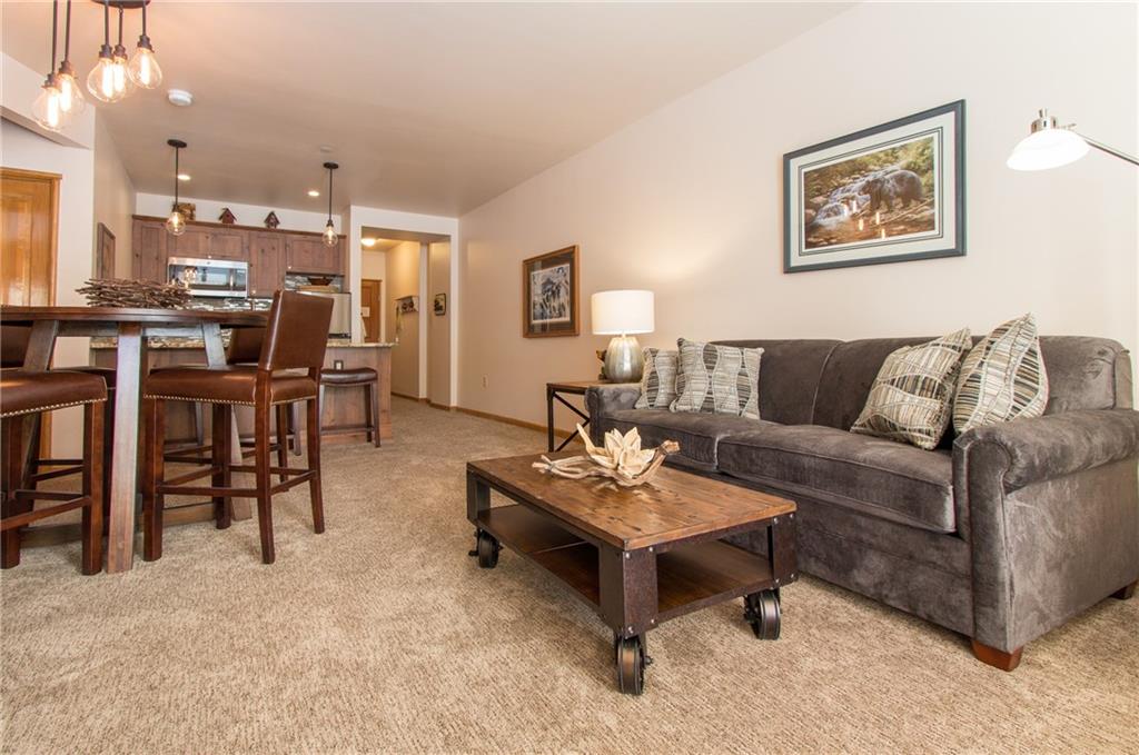 129 River Run Road, Unit 8061 Keystone, CO 80435 - Photo 2 of 19 a living room with furniture and a table