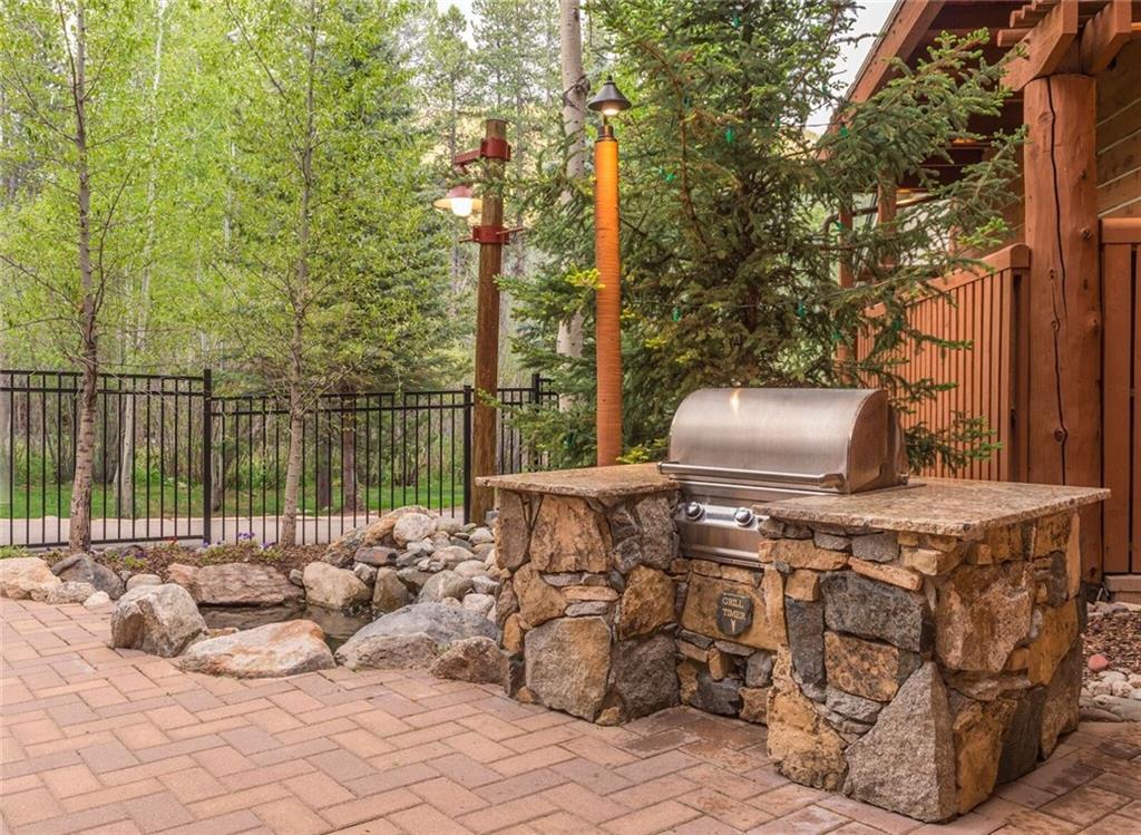129 River Run Road, Unit 8061 Keystone, CO 80435 - Photo 15 of 19 a roof deck with couches and wooden fence