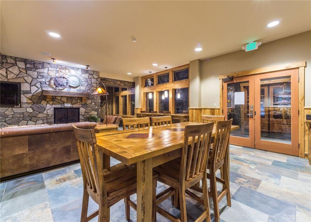 129 River Run Road, Unit 8061 Keystone, CO 80435 - Photo 16 of 19 a dining table with chairs and window