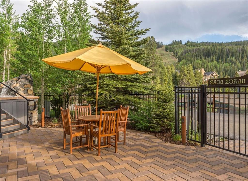 129 River Run Road, Unit 8061 Keystone, CO 80435 - Photo 19 of 19 an outdoor space with furniture and umbrella