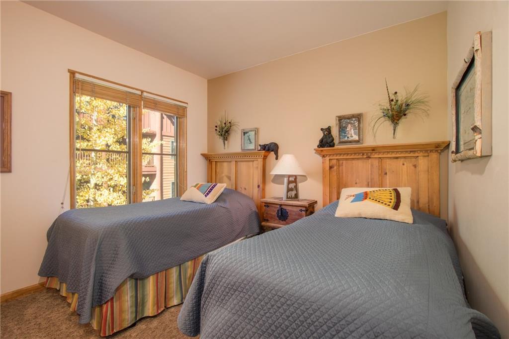 129 River Run Road, Unit 8061 Keystone, CO 80435 - Photo 7 of 19 a bedroom with two beds and a window