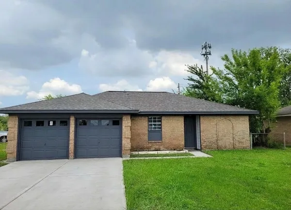 front view of a house with a garden
