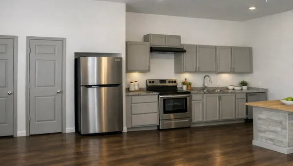 a kitchen with a refrigerator stove and wooden cabinets