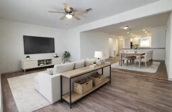 a living room with furniture and a flat screen tv