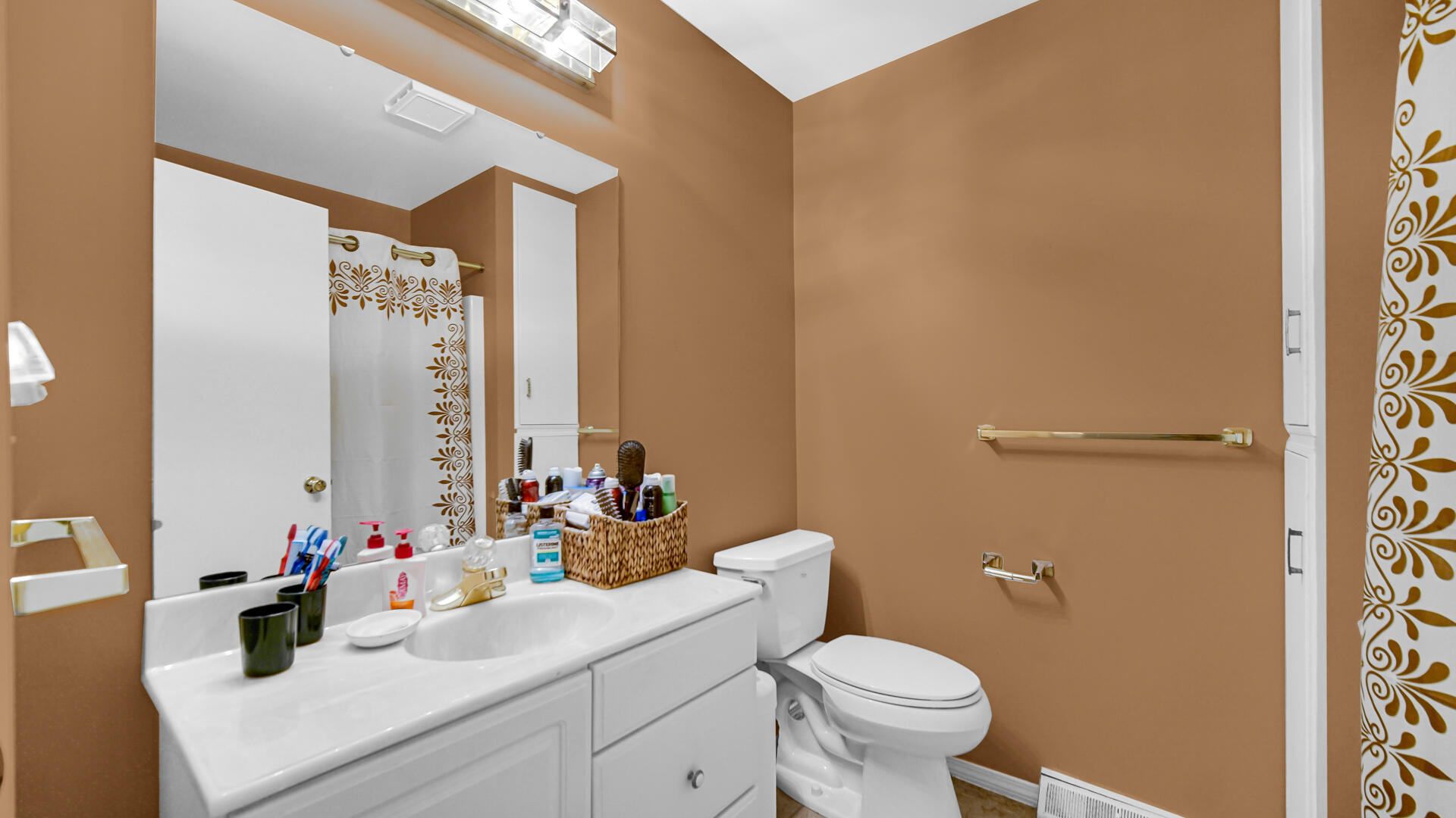8135 South 600 East Monterey, IN 46960 - Photo 13 of 34 a bathroom with a sink a toilet and a mirror