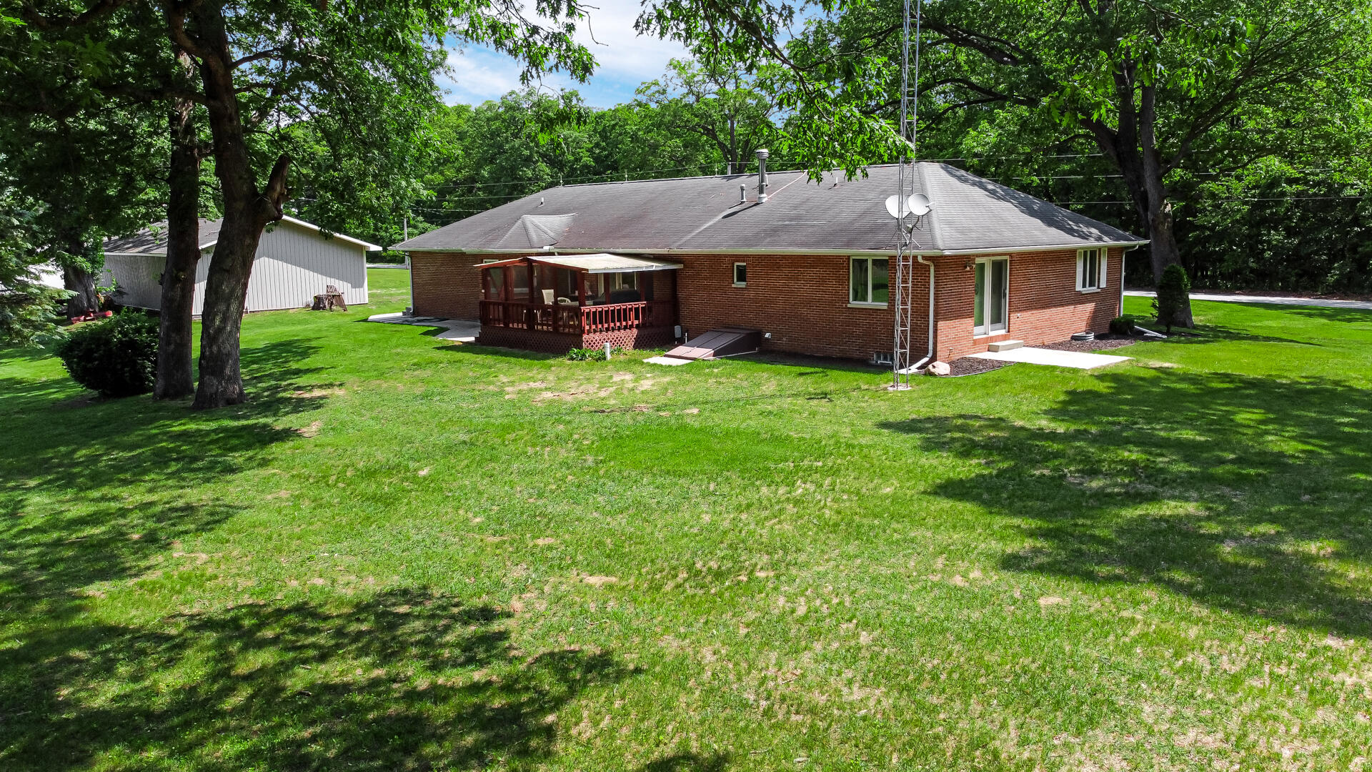 8135 South 600 East Monterey, IN 46960 - Photo 34 of 34 a aerial view of a house with a yard table and chairs