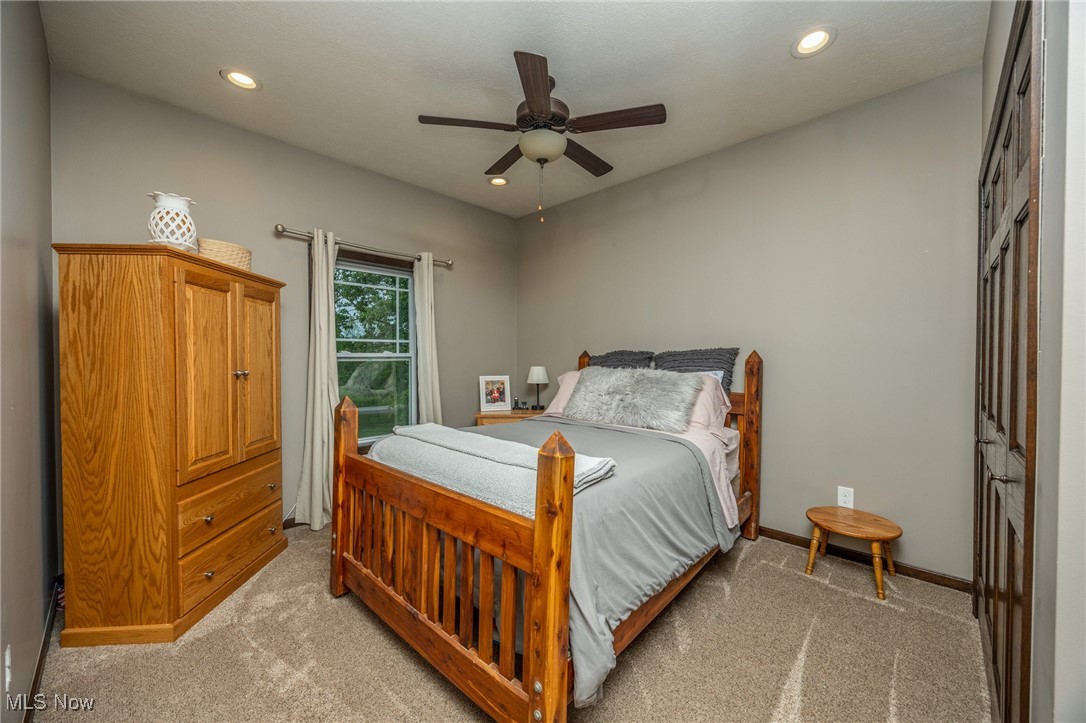 2851 Barnett Ridge Road Fleming, OH 45729 - Photo 28 of 40 Bedroom featuring light carpet, recessed lighting, ceiling fan, and baseboards